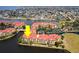 Unique aerial view of condos surrounded by a lake in a densely populated residential area at 99 Vivante Blvd # 311, Punta Gorda, FL 33950
