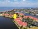 Beautiful aerial shot of condo community with red roofs along a picturesque waterfront with surrounding neighborhoods at 99 Vivante Blvd # 311, Punta Gorda, FL 33950