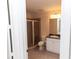 This bathroom has a glass door shower, standard toilet, and large mirror at 99 Vivante Blvd # 311, Punta Gorda, FL 33950