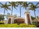 Elegant Vivante at Punta Gorda community entrance sign, complemented by lush greenery and palm trees at 99 Vivante Blvd # 311, Punta Gorda, FL 33950