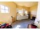 Partially furnished garage space, featuring cabinets, counter, and storage, with two windows at 99 Vivante Blvd # 311, Punta Gorda, FL 33950