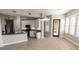 Bright kitchen with white cabinets, stainless appliances, and tile flooring at 99 Vivante Blvd # 311, Punta Gorda, FL 33950