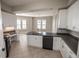 Modern kitchen featuring white cabinets, stainless steel appliances, and an open design at 99 Vivante Blvd # 311, Punta Gorda, FL 33950