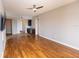 Open living room with hardwood floors seamlessly transitions to the kitchen, complete with a wet bar at 99 Vivante Blvd # 311, Punta Gorda, FL 33950