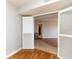View of open living room with wooden floors and access to a mini bar at 99 Vivante Blvd # 311, Punta Gorda, FL 33950
