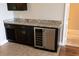 Convenient wet bar with a wine fridge and granite countertops is a great feature at 99 Vivante Blvd # 311, Punta Gorda, FL 33950