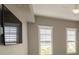 This bedroom has lots of natural lighting and a mounted flat screen TV at 99 Vivante Blvd # 311, Punta Gorda, FL 33950