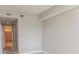 Neutral-colored room with large closets and view into a full bathroom at 99 Vivante Blvd # 311, Punta Gorda, FL 33950