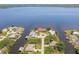 Waterfront homes nestled on the canal, boast lush landscaping and water access at 12439 Prather Ave, Port Charlotte, FL 33981