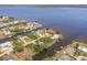 Waterfront homes line the canal, with boat access and lush tropical landscaping at 12439 Prather Ave, Port Charlotte, FL 33981