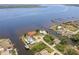 Aerial shot of sprawling waterfront homes on canal, with lush landscaping and circular driveways at 12439 Prather Ave, Port Charlotte, FL 33981