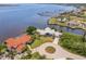 Waterfront home boasts lush landscaping, circular driveway and stunning views of the canal at 12439 Prather Ave, Port Charlotte, FL 33981