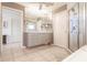 Bathroom featuring an oversized vanity with double sinks and a glass enclosed shower at 12439 Prather Ave, Port Charlotte, FL 33981