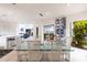 Bright dining room featuring a glass table, stylish chairs, and water views at 12439 Prather Ave, Port Charlotte, FL 33981