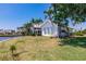 Beautiful single-story home showcasing meticulous landscaping and serene canal views at 12439 Prather Ave, Port Charlotte, FL 33981