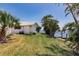 Waterfront property with mature tropical landscaping along the canal in a residential neighborhood at 12439 Prather Ave, Port Charlotte, FL 33981