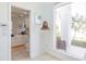 Hallway view featuring a sculpture and partial view into the bathroom at 12439 Prather Ave, Port Charlotte, FL 33981