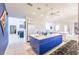 Bright, open kitchen with an island, white cabinetry, and modern appliances at 12439 Prather Ave, Port Charlotte, FL 33981