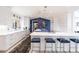 Bright, modern kitchen with sleek white cabinetry, island seating, and stylish accents at 12439 Prather Ave, Port Charlotte, FL 33981