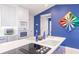 Gourmet kitchen featuring modern appliances and a stylish, functional island for entertaining at 12439 Prather Ave, Port Charlotte, FL 33981