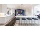 Bright, modern kitchen with sleek white cabinetry, island seating, and stylish accents at 12439 Prather Ave, Port Charlotte, FL 33981