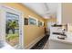 Bright laundry room features natural light and access to the backyard at 12439 Prather Ave, Port Charlotte, FL 33981