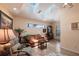 Inviting living room features vaulted ceilings with skylights and a comfortable seating arrangement at 12439 Prather Ave, Port Charlotte, FL 33981
