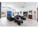 Bright living room featuring high ceilings and contemporary decor with seating and TV at 12439 Prather Ave, Port Charlotte, FL 33981