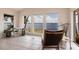 Water view living room features tile floors, white walls and beautiful water views from large picture windows at 12439 Prather Ave, Port Charlotte, FL 33981