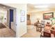 Living room featuring hardwood floors, skylights, and a sitting area with orange sofa at 12439 Prather Ave, Port Charlotte, FL 33981