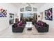 Bright living room with tile flooring, comfortable seating, and panoramic views of the waterfront at 12439 Prather Ave, Port Charlotte, FL 33981