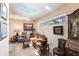 Bright living room featuring hardwood floors, skylights, sitting area, with a view to the outside at 12439 Prather Ave, Port Charlotte, FL 33981