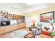 Bright living room featuring hardwood floors, skylights, and built in cabinets at 12439 Prather Ave, Port Charlotte, FL 33981
