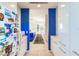 Hallway leading to a bright open-concept living and kitchen area at 12439 Prather Ave, Port Charlotte, FL 33981