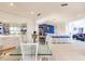 Spacious living area featuring an open layout, dining area, and modern kitchen at 12439 Prather Ave, Port Charlotte, FL 33981