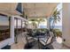 Spacious screened patio offers a serene view of the water and lush landscaping at 12439 Prather Ave, Port Charlotte, FL 33981