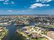 A captivating aerial view showcasing the vast network of canals within this stunning waterfront community at 1255 Eider Ct, Punta Gorda, FL 33950