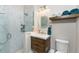 Bathroom featuring a glass-enclosed shower, and wood vanity with a white countertop at 1255 Eider Ct, Punta Gorda, FL 33950