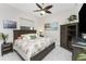 Relaxing bedroom with palm-themed bedding, ceiling fan, and dark wood furniture at 1255 Eider Ct, Punta Gorda, FL 33950