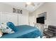 Bright bedroom with comfortable bed, ceiling fan, and a view of the yard at 1255 Eider Ct, Punta Gorda, FL 33950