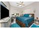 Comfortable bedroom featuring a bed, desk, ceiling fan and lots of natural light at 1255 Eider Ct, Punta Gorda, FL 33950