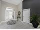 Inviting foyer with decorative glass door, high ceilings, elegant decor, and light tile flooring at 1255 Eider Ct, Punta Gorda, FL 33950