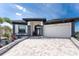 Charming single-story home with manicured landscaping and a paver driveway at 1255 Eider Ct, Punta Gorda, FL 33950