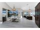 Open kitchen with a chandelier and table setup, offering backyard and waterfront views at 1255 Eider Ct, Punta Gorda, FL 33950