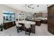 Open kitchen featuring granite countertops, custom cabinets, bar stool seating, and backyard water views at 1255 Eider Ct, Punta Gorda, FL 33950