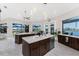 Spacious kitchen boasts granite countertops, stainless steel appliances, and beautiful views through large windows at 1255 Eider Ct, Punta Gorda, FL 33950