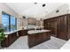 Spacious kitchen featuring a center island, stainless appliances, custom cabinets, and granite countertops at 1255 Eider Ct, Punta Gorda, FL 33950