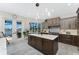 Gourmet kitchen features custom cabinetry, a large island, and waterfront views at 1255 Eider Ct, Punta Gorda, FL 33950