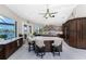 Open kitchen featuring a granite island, stainless appliances, a ceiling fan, and beautiful water views at 1255 Eider Ct, Punta Gorda, FL 33950