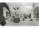 Spacious living room featuring high ceilings, modern decor, sleek tile flooring, and ample seating at 1255 Eider Ct, Punta Gorda, FL 33950